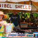Shelle Kelle with her homemade shell bucket advertising the 81st annual Sanibel Shell Show.